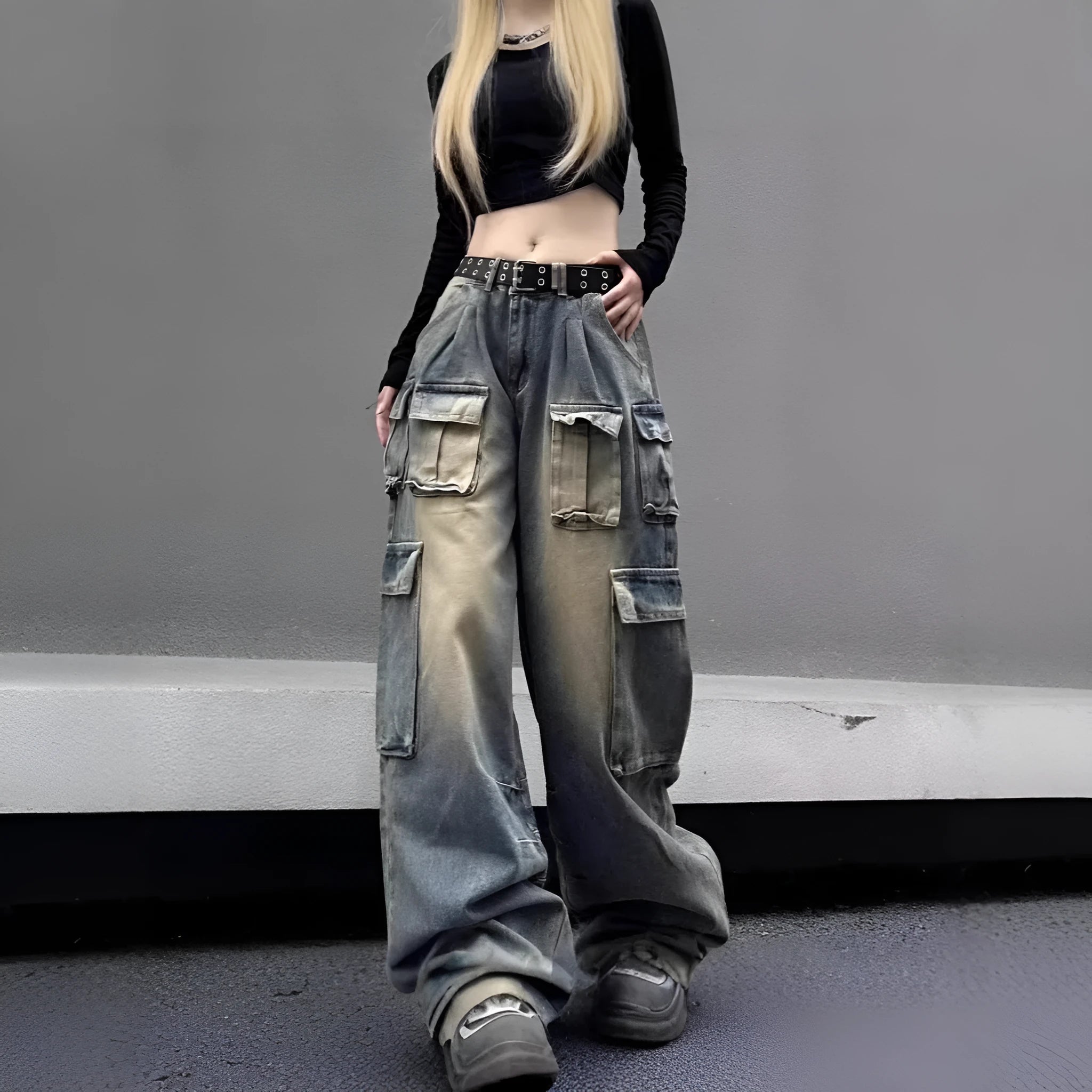 Loose-fit distressed denim jeans with multiple tooling pockets in light blue colour
