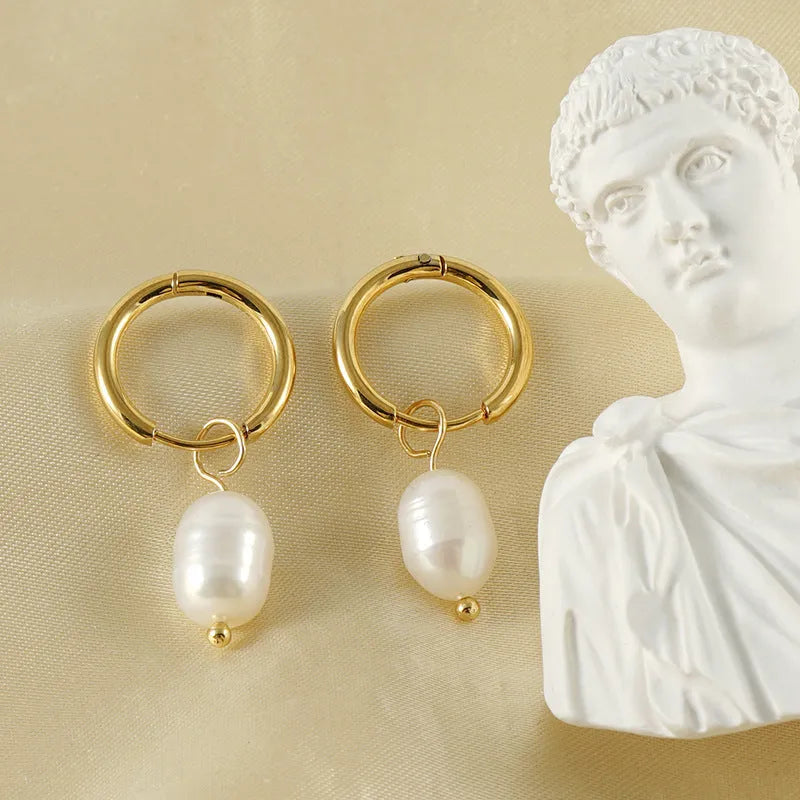 Gold geometric pearl earrings for women made from stainless steel with electroplated finish.