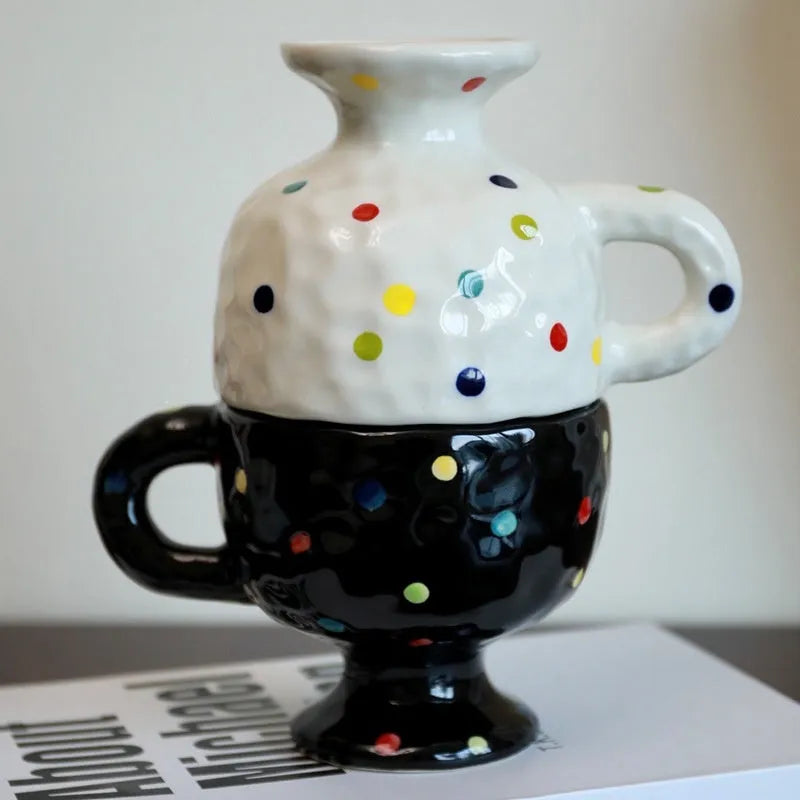 Hand-pinched irregular ceramic mug with modern minimalist design in solid colour