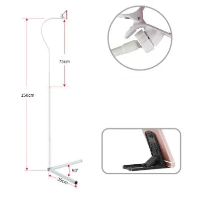 Black mobile phone bed bracket mounted on bedside with phone secured in universal folder for hands-free viewing