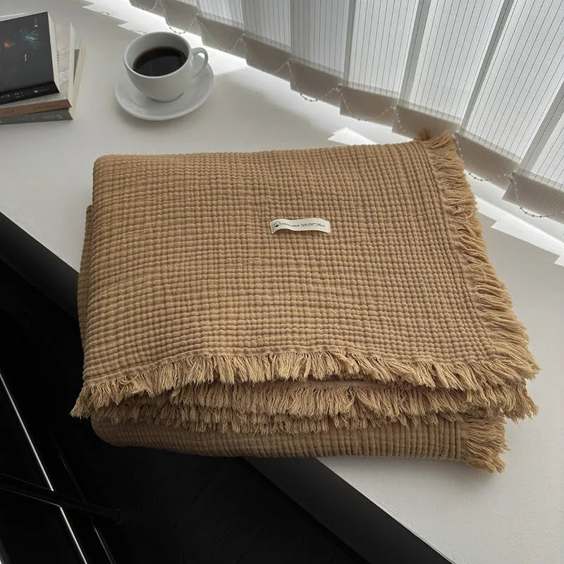 Four-layer gauze cotton blanket with tassel trim in navy blue colour