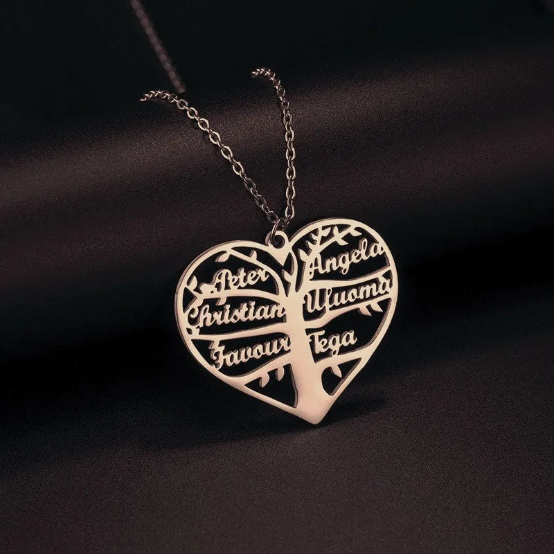 Custom stainless steel necklace with a life tree and hollow heart pendant engraved with names, shown in silver finish.