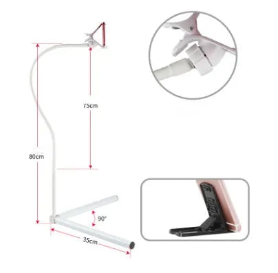 Black mobile phone bed bracket mounted on bedside with phone secured in universal folder for hands-free viewing