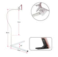 Black mobile phone bed bracket mounted on bedside with phone secured in universal folder for hands-free viewing