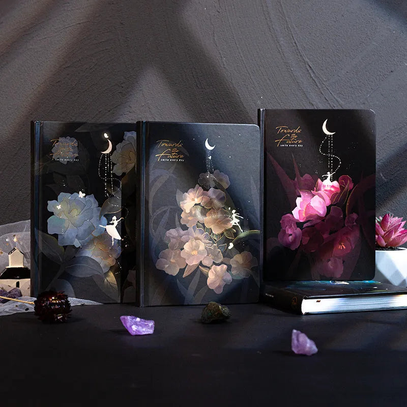 A5 notebook with luminous purple cover open to show pages filled with colour illustrations.