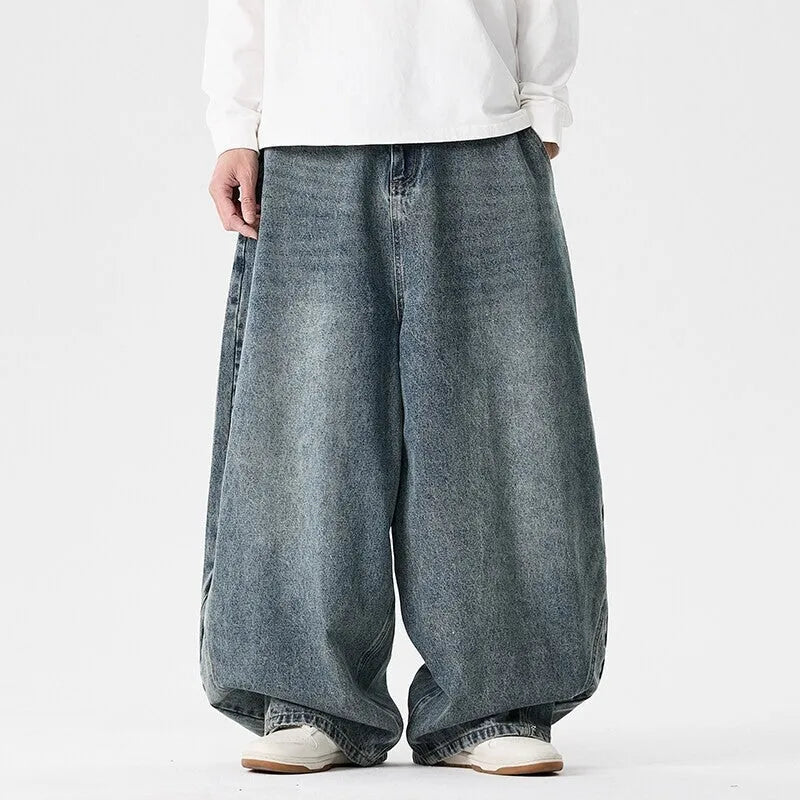 Men's plus-size light blue baggy jeans with a straight leg and zip fly