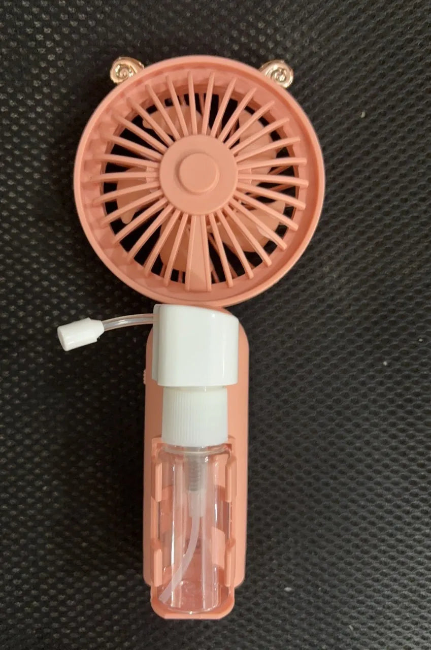A handheld USB personal fan in one of five colours: apricot, blue, green, orange, or pink, showing its plastic nozzle and compact size.