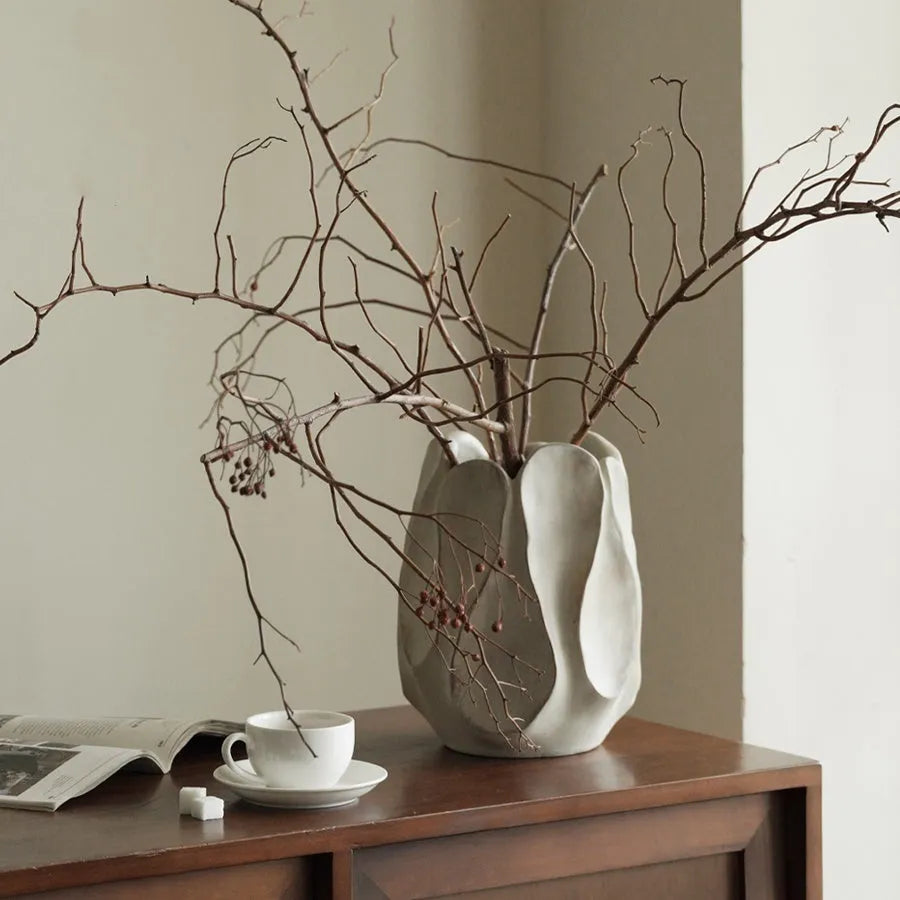 Irregular ceramic art vase in magnesium clay with resin decorative elements for floral arrangements