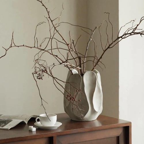 Irregular ceramic art vase in magnesium clay with resin decorative elements for floral arrangements