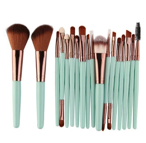 MAANGE 18-piece makeup brush set with fan-shaped cosmetic tools laid out on a table.