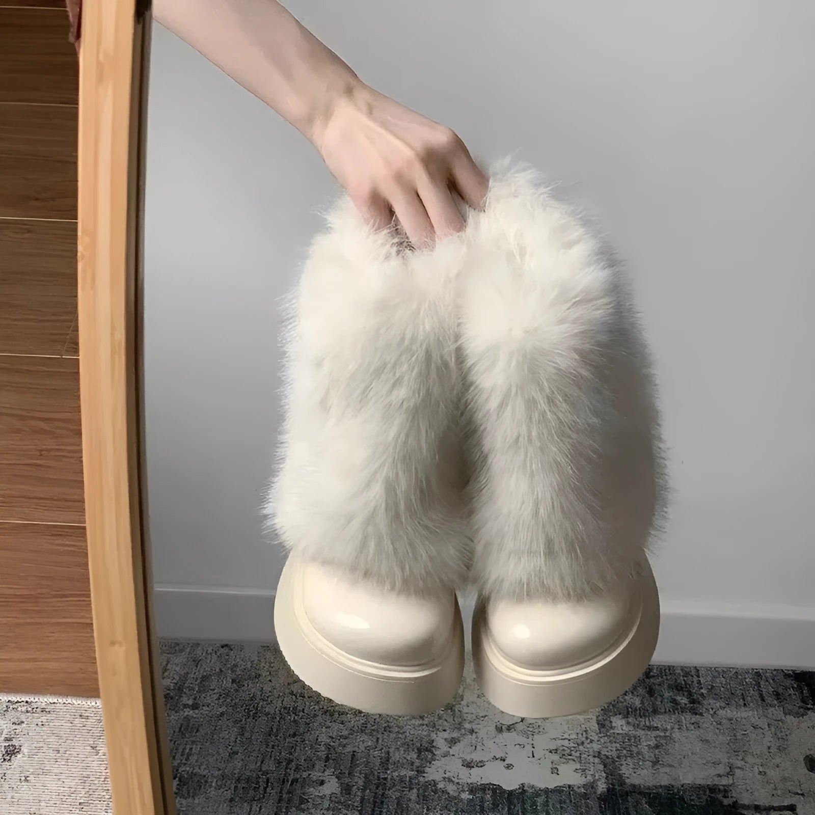 Women's black fleece-lined snow boots with rubber sole and mid heel