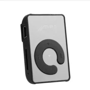 Black plastic clip MP3 player with TF card slot and mini USB port on a plain background