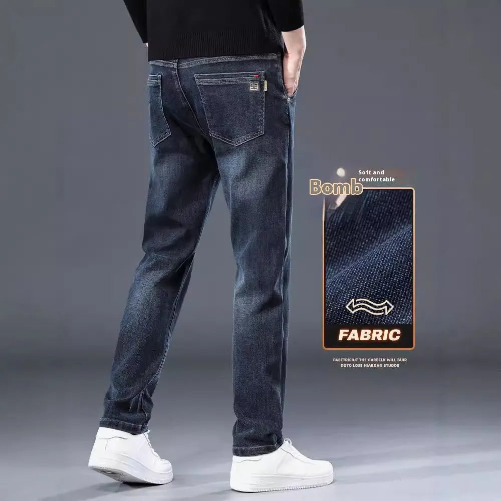 Blue grey slim straight casual trousers with a mid-waist and elastic comfort on a neutral background.