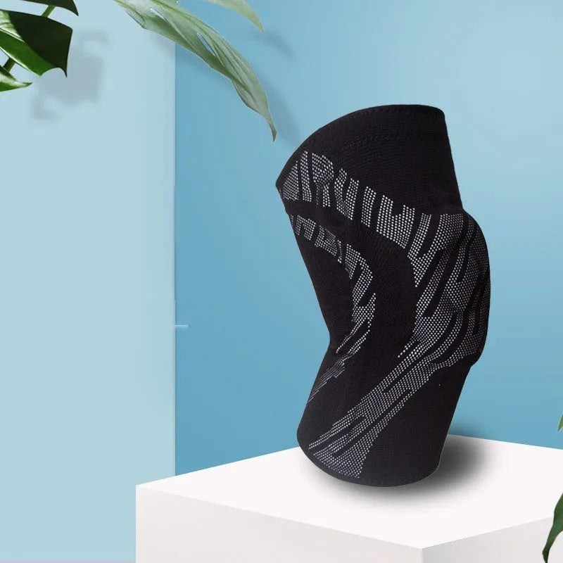 A black pressurised nylon knee pad for men's basketball, shown laid flat.