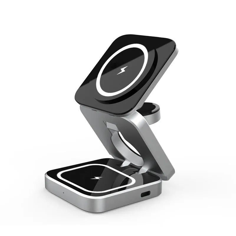 Foldable three-in-one wireless charging bracket for Apple, Samsung phones, and Google Pixel Watch on a desk.