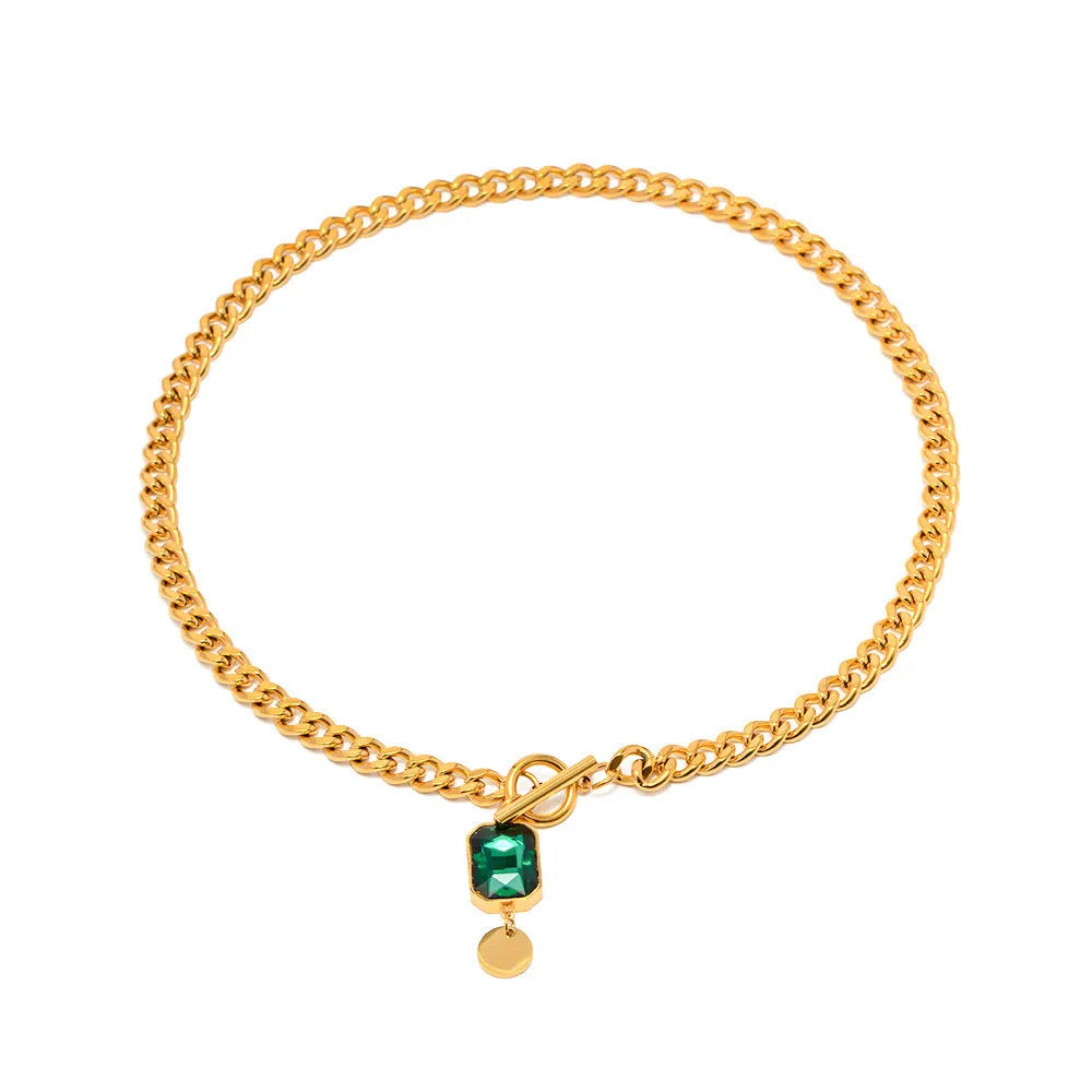 Gold electroplated titanium steel necklace with emerald zircon pendant and Cuban link chain