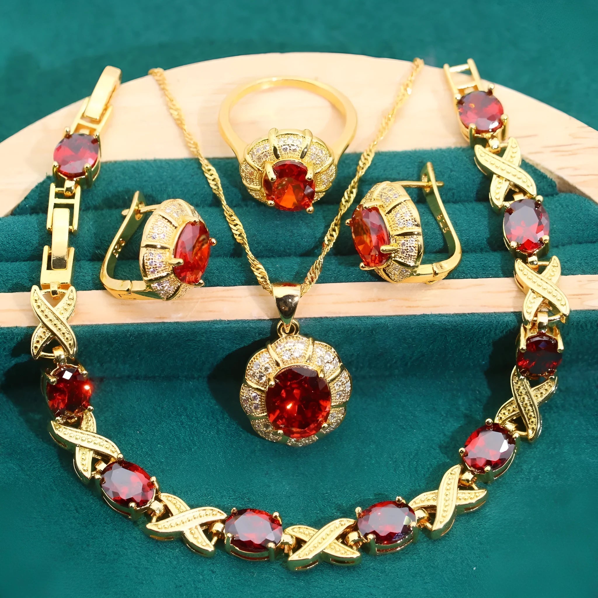 Gold-plated necklace, earrings, ring and bracelet set with blue cubic zirconia stones.