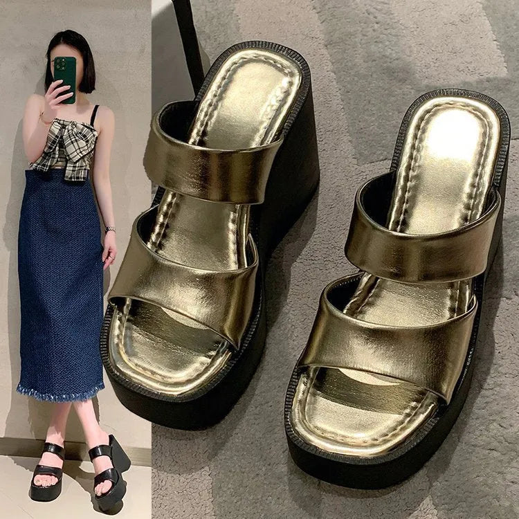 Women's black wedge platform slippers with square toe and PU upper.