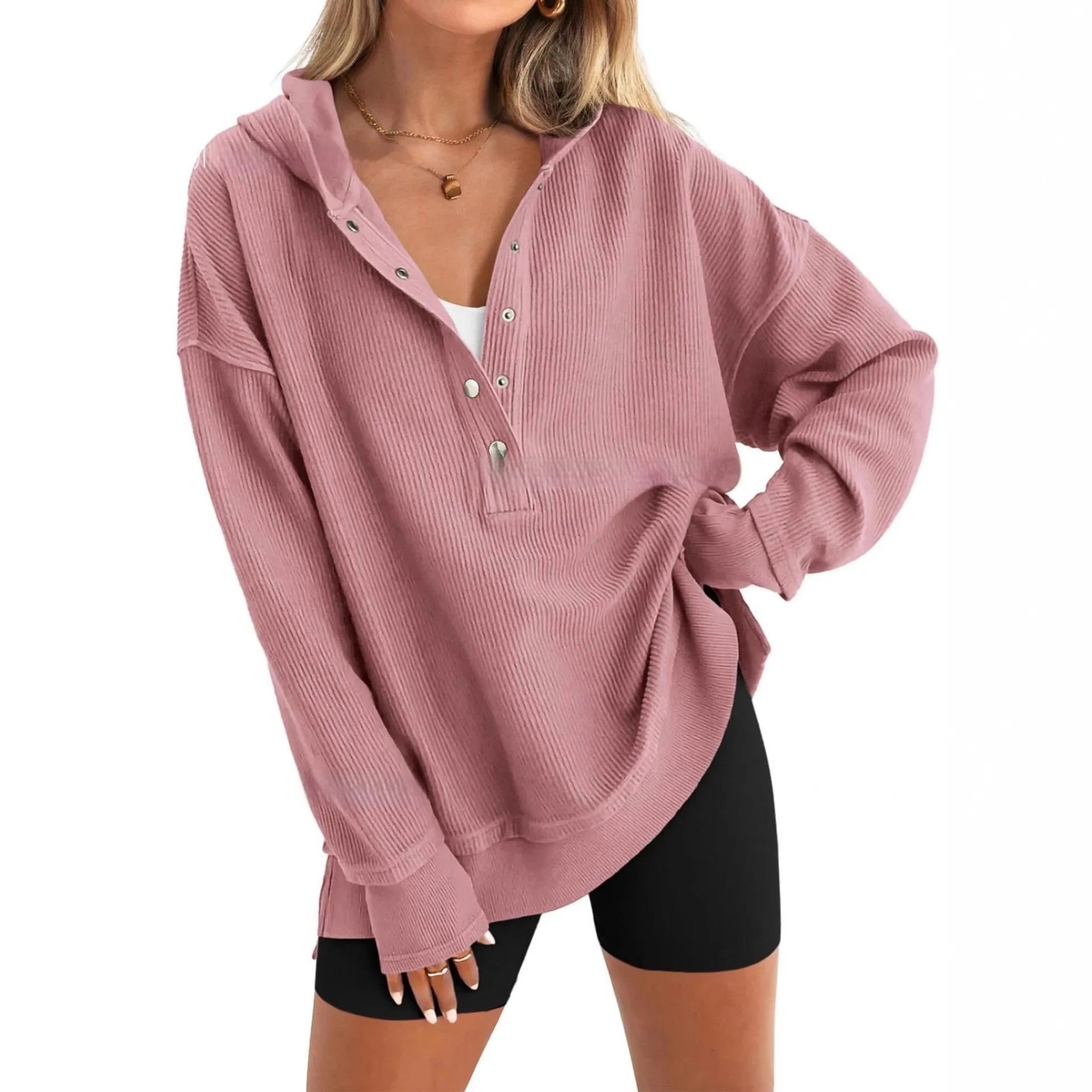 Women's loose peacock green raglan sleeve pullover sweater on a hanger.