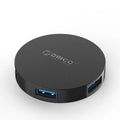 ORICO HA4U-U3 USB 3.0 hub with four ports, compact black plastic casing, 60x60x12mm