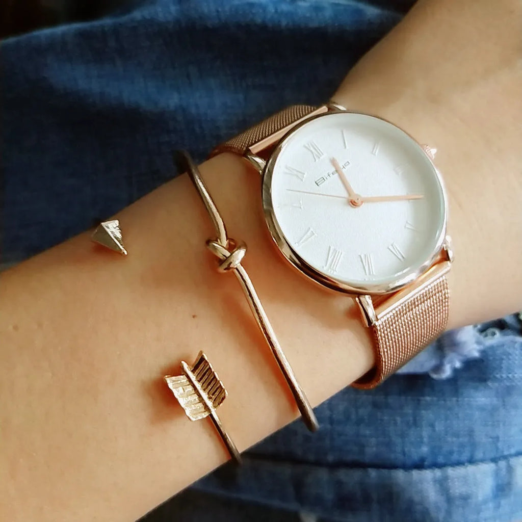 Women's vintage gold arrow knotted cuff bracelet made from electroplated alloy.