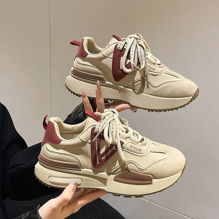 Women's black retro platform sports shoes with round toe and front lace-up closure.