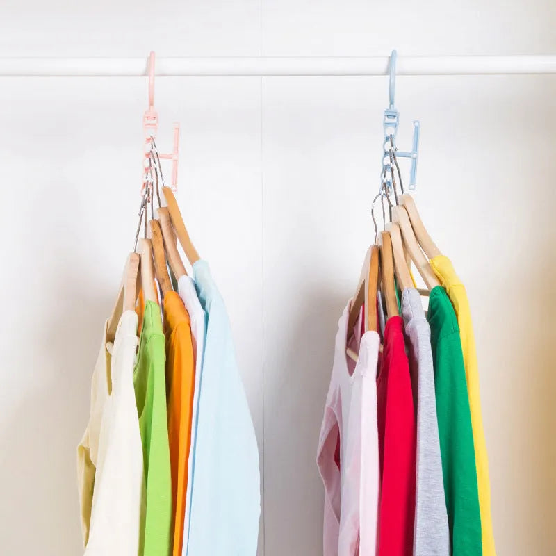 Blue revolving wardrobe hanger with five branches and a central handle for organising clothes.