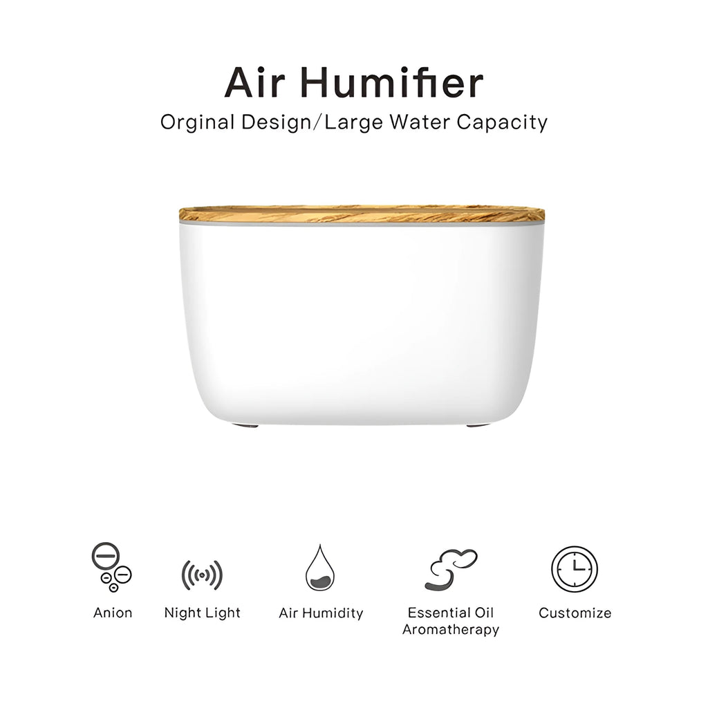 GX-22K white aromatherapy humidifier with night light and water tank on a wooden table.