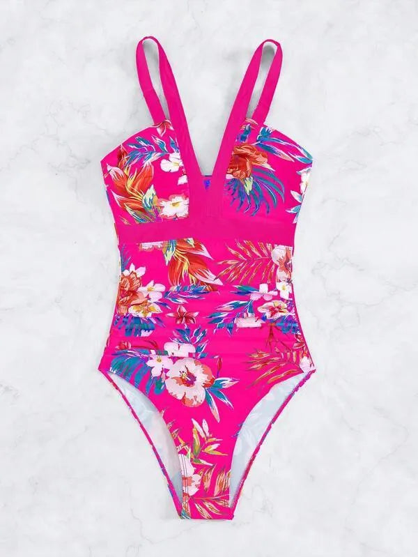 Women's black floral backless one-piece swimsuit on a mannequin