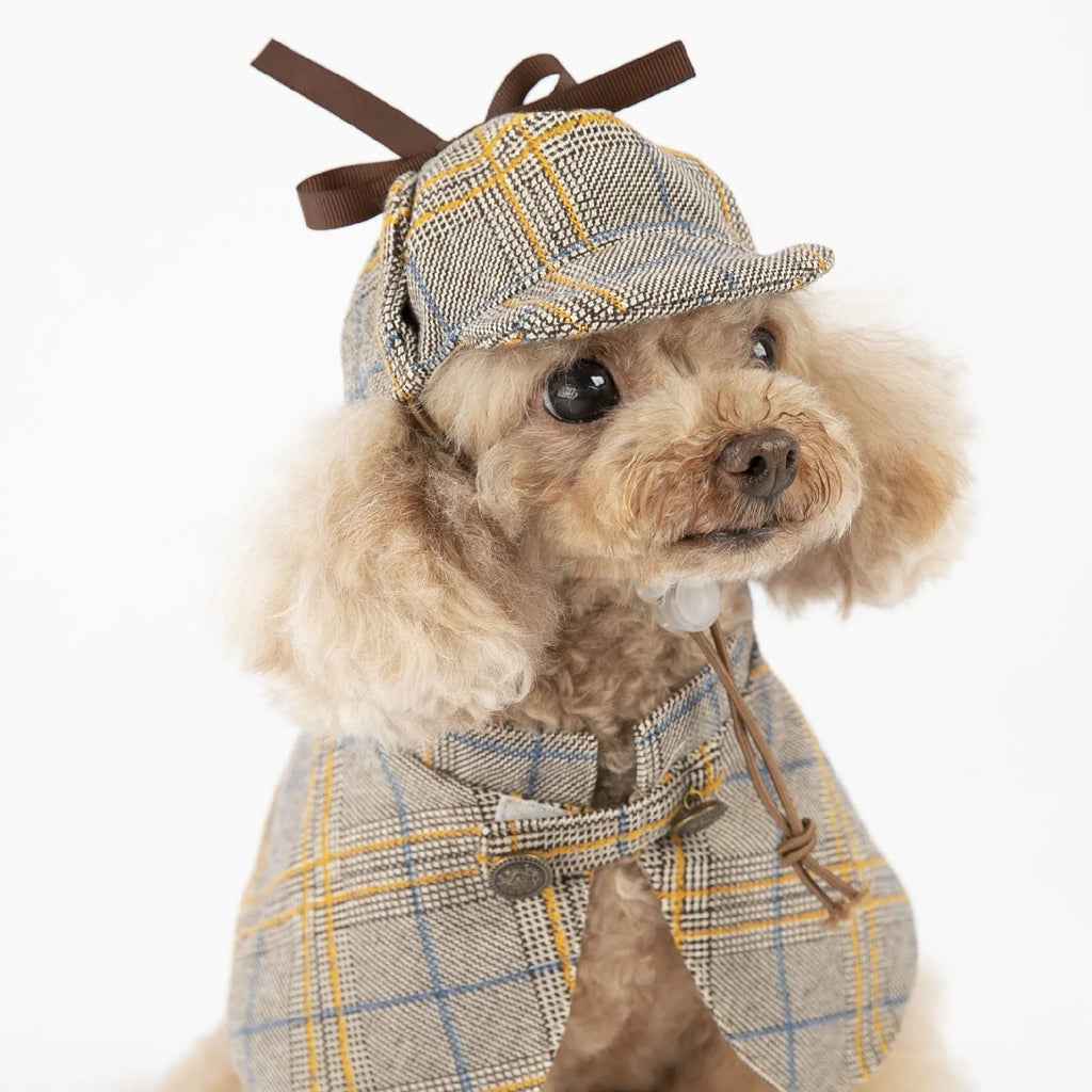 Camel-coloured cotton detective suit cloak for a small dog on a neutral background.