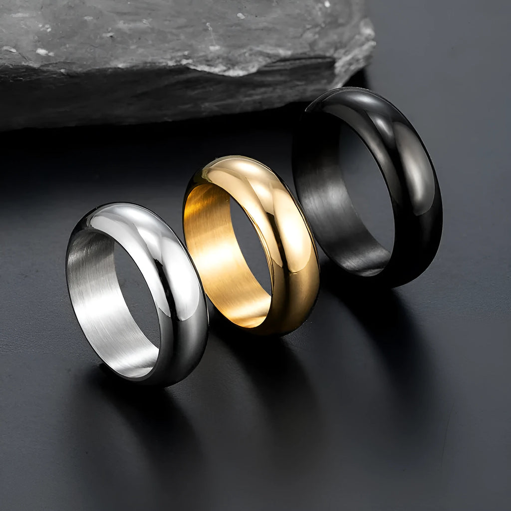 Glossy electroplated titanium steel ring in gold, black, and steel colours showing band detail