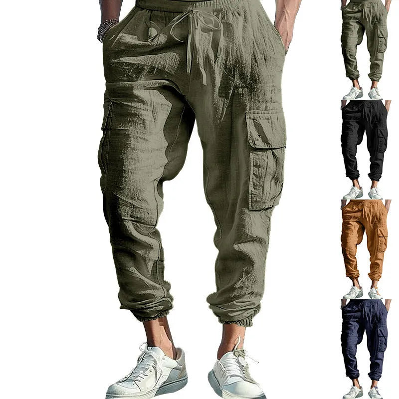 Man wearing loose-fit linen casual trousers with ankle-tied cuffs and multiple pockets in a solid colour.