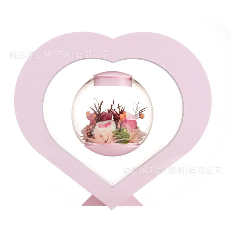 Pink preserved rose decorative ornament with optional base and Bluetooth speaker functionality.