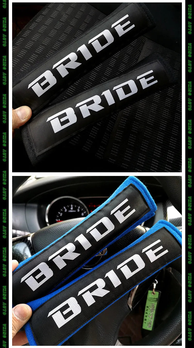 Pair of black cotton seat belt shoulder sleeves with embroidery, shown next to a car seat.