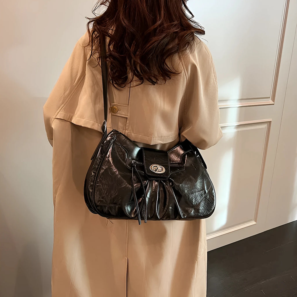 Women's horizontal square PU crossbody bag in black with single strap for shoulder or underarm carry, 30cm length