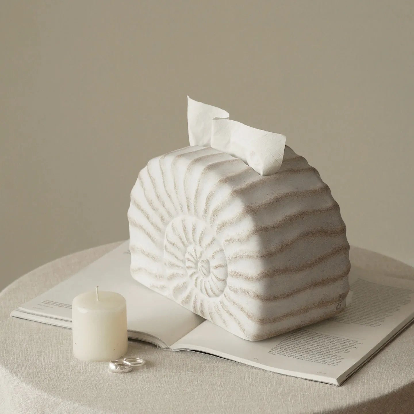 A modern conch ramble coloured resin tissue box for home or office desk organisation.