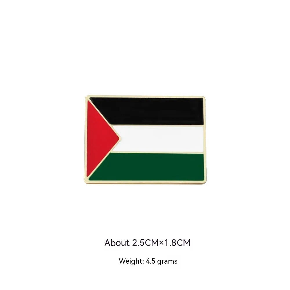 Square corrugated alloy brooch with Palestinian flag design on a neutral background