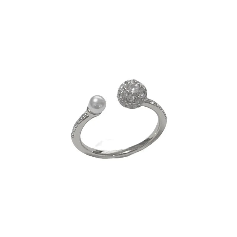 Gold plated open-end ring with round zircon pearl element on copper base