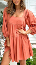 Orange red children's dress with square collar and puff sleeves, backless design with A-line skirt
