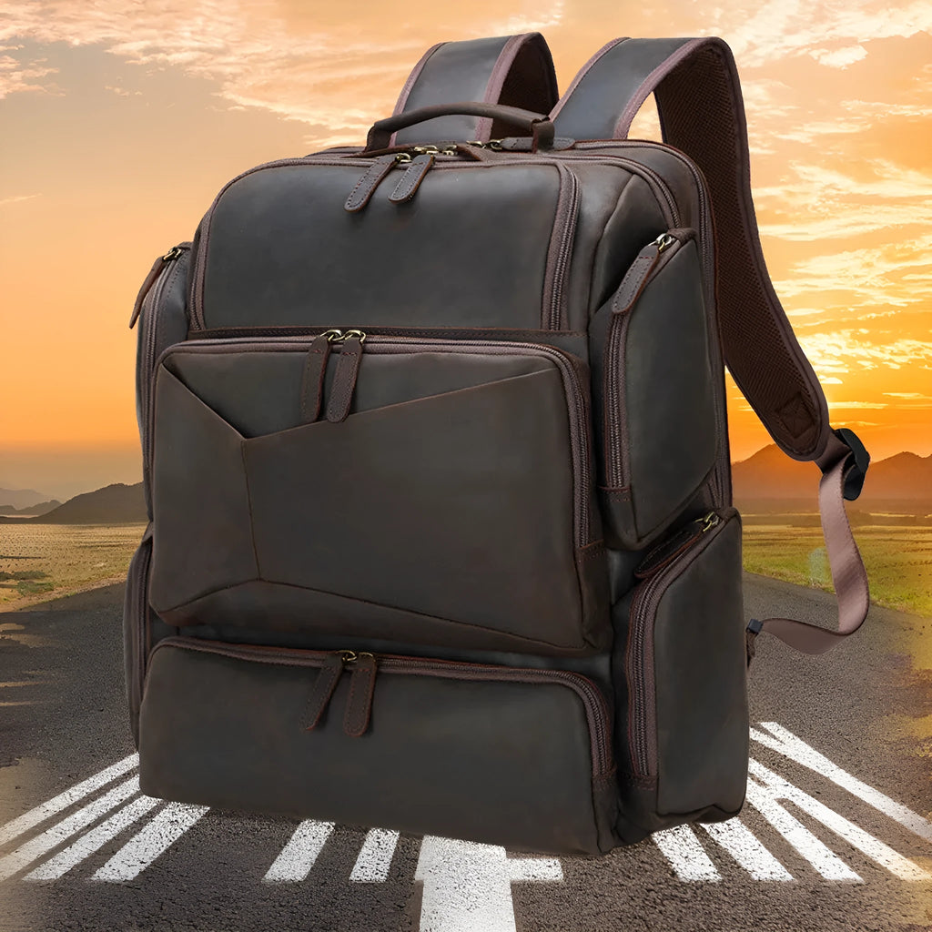 Dark brown genuine cowhide leather backpack with 17-inch laptop compartment and multiple internal organisers