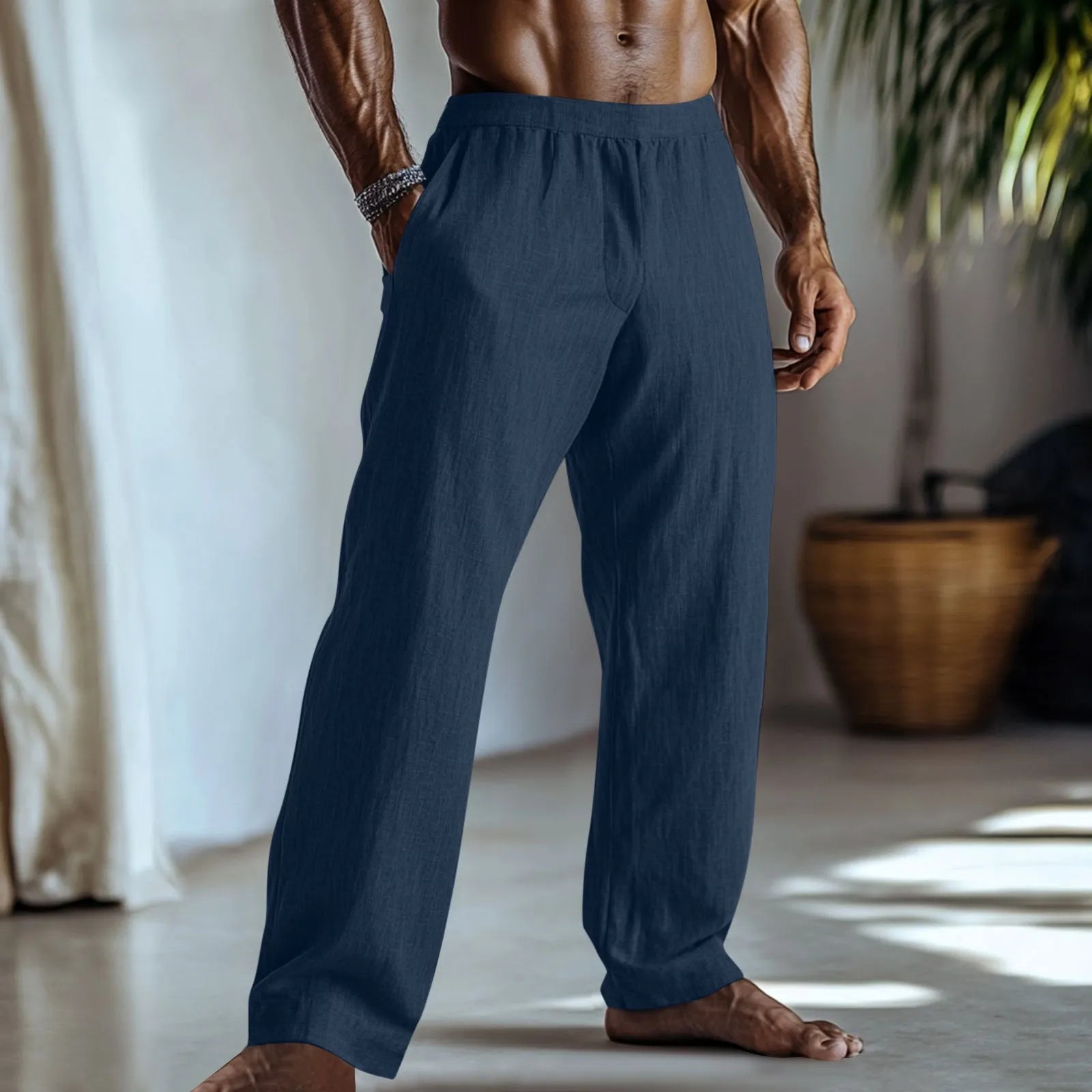 Straight leg cotton linen trousers in light green colour with visible front pockets on a plain background