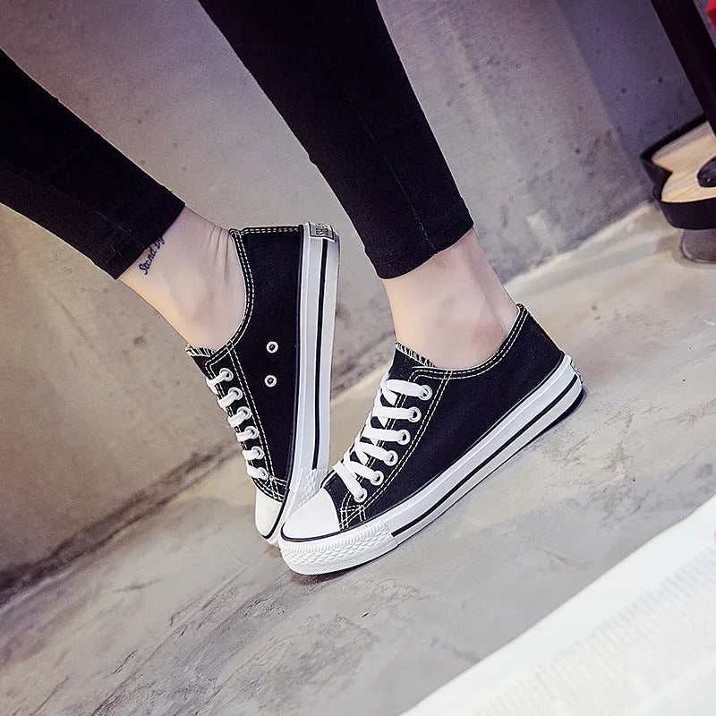 Women's solid colour casual canvas shoes in lace-up style on a white background.