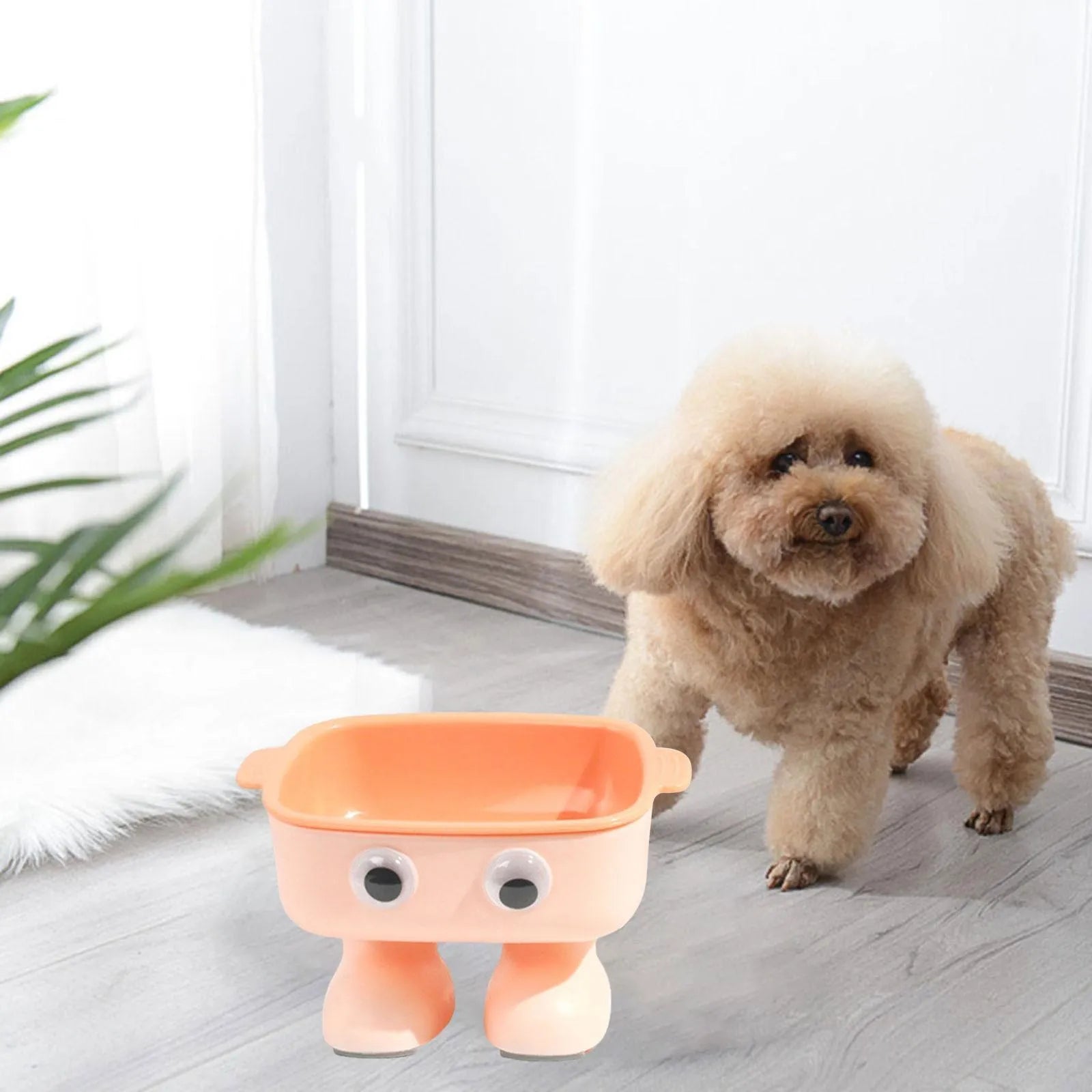 Green robot-shaped elevated cat bowl with tilted design and detachable inner dish