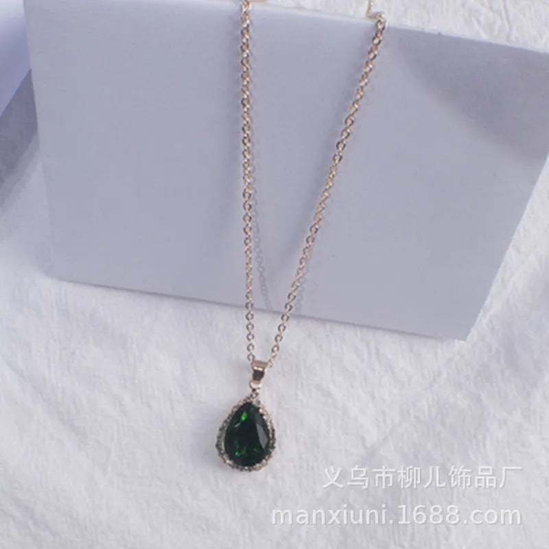 Rose gold water drop shape necklace with rhinestone geometric detailing in pink colour