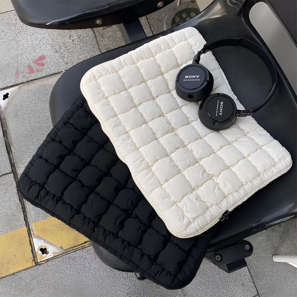 Black and white nylon laptop bag for 11-inch to 15.6-inch devices with large storage capacity.