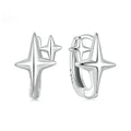 Minimalist oxidised sterling silver star ear clip with XINGX detail on a white background.
