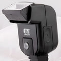 SLR camera flash accessory with upward tilt feature showing compact design and hot shoe mount