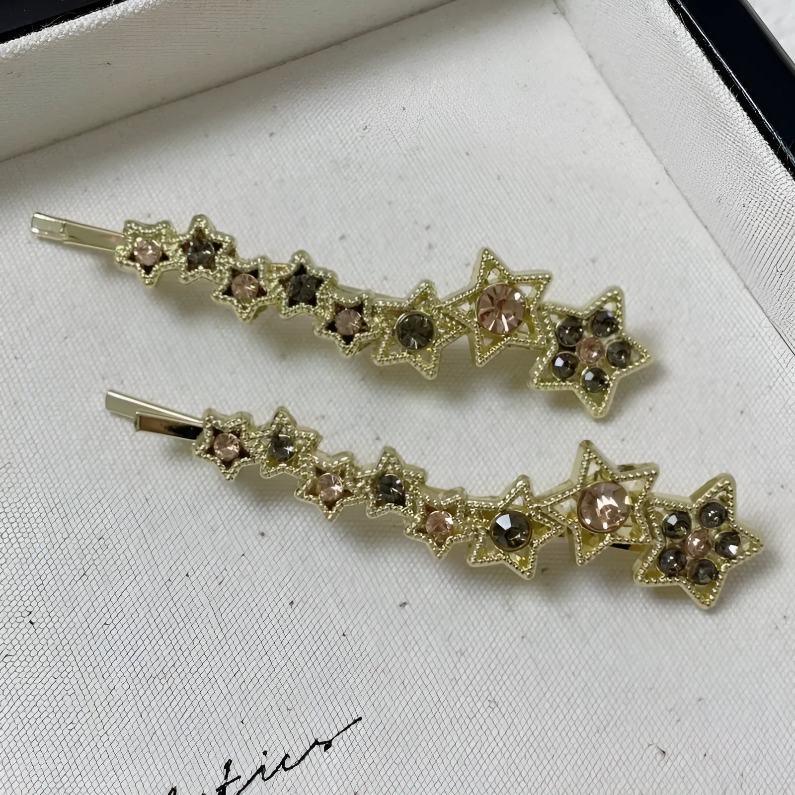 Gold-coloured Korean style hair clip barrette with side clip design and five-pointed star decoration