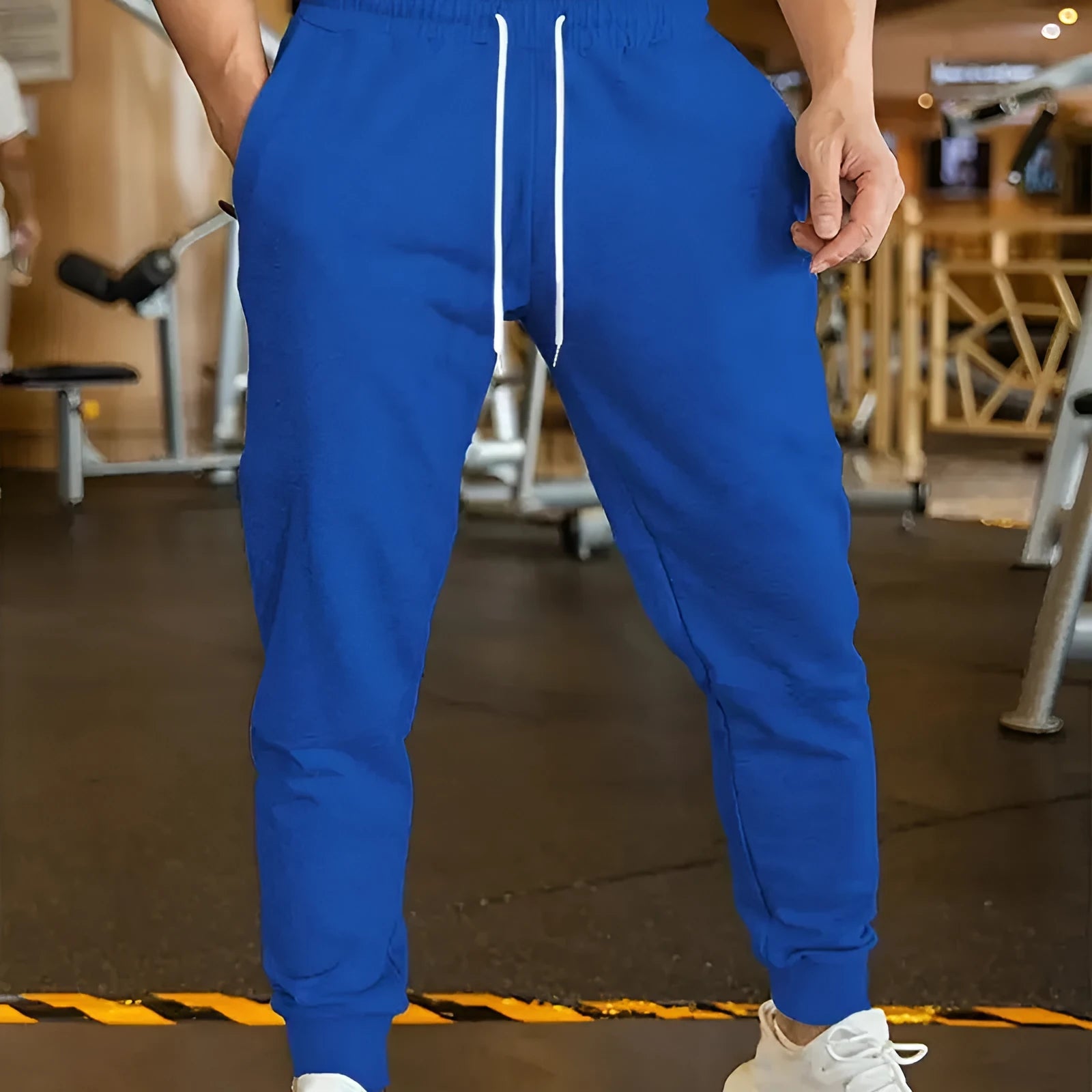 Men's polyester leisure trousers with elastic lace closure and drawstring waist in loose fit design