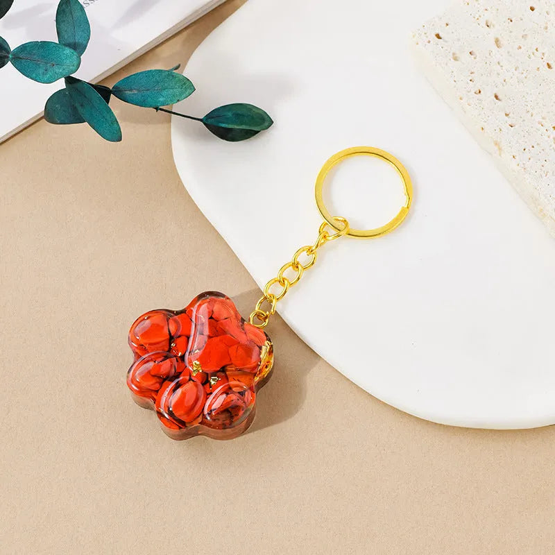 Natural crystal cat's paw keychain pendant charm in one of ten crystal types including pink crystal and amethyst.